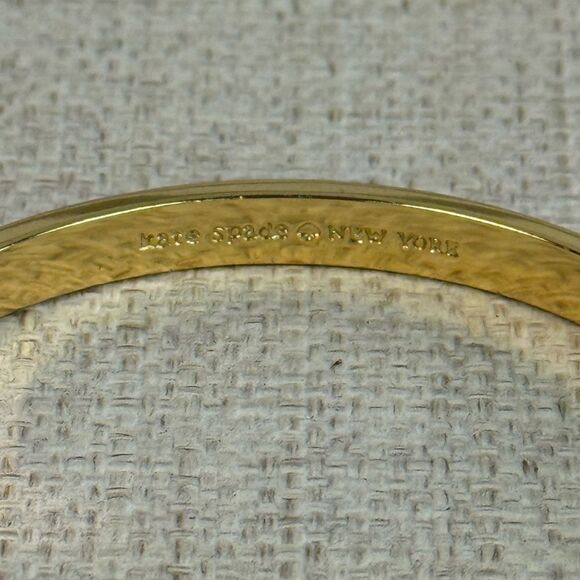 Kate Spade Cream & Gold Enamel Take A Bow Bangle Bracelet - Picture 3 of 4